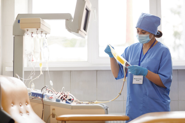 A-medical-professional-prepares-a-blood-plasma-bag-in-a-hospital-or-clinic-setting.png